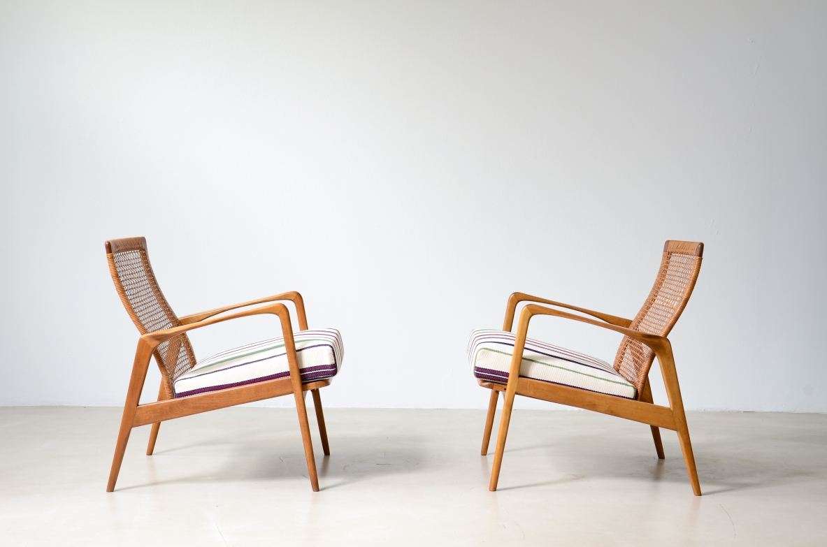 Pair of small armchairs in shaped wood, Scandinavian manufacture, circa 1960.