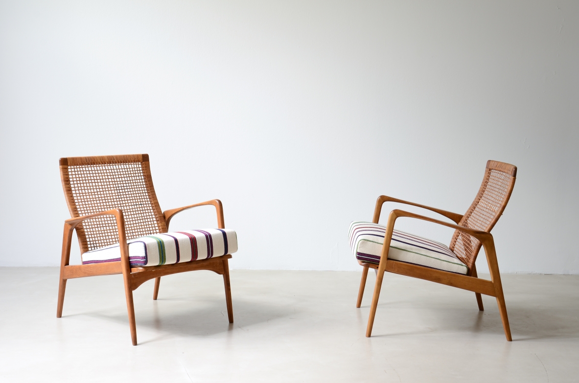 Pair of small armchairs in shaped wood, Scandinavian manufacture, circa 1960.