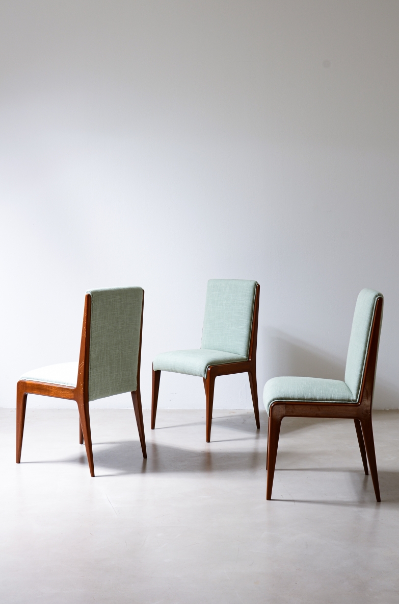Set of eight chairs by Gio Ponti, Italian manufacture, 1955, featuring polished wooden frames and upholstered fabric covering.