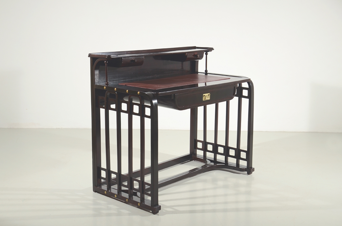 Rare Josef Hoffmann writing desk designed in 1906 for Jacob & Josef Kohn, Vienna, in mahogany-stained beechwood with geometric lattice frame, raised back, drawer and brass details.