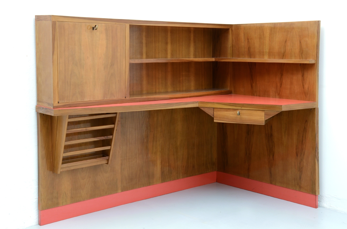 Stunning corner desk with newspaper holder, bar and shelves.