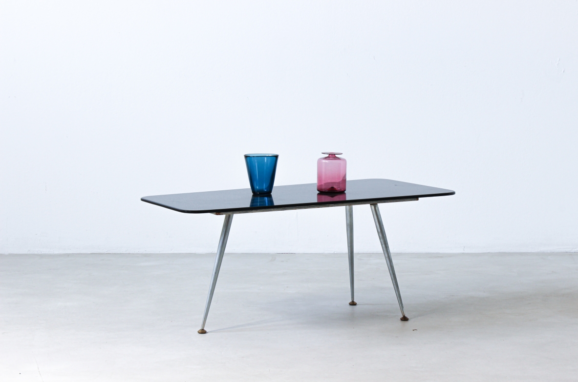 Coffee table with opaline glass top and aluminum legs with brass ends.