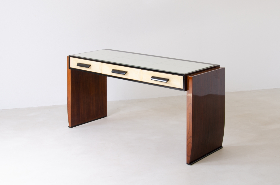 Splendid rosewood console table with three drawers covered in parchment and top in ground mirror.  Italian manufacture, 1930's.