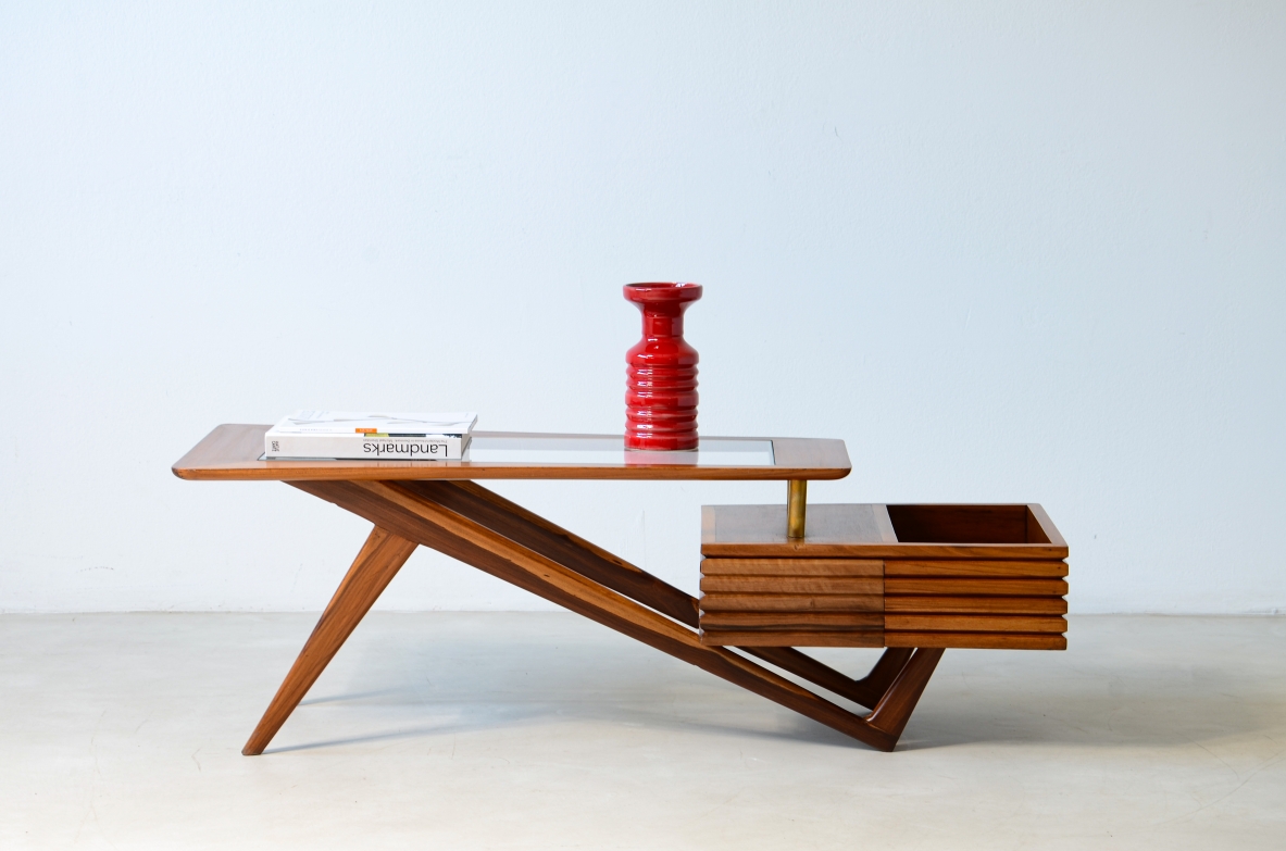 Rare modernist table by Mario Gottardi featuring a wood and bevelled glass top, storage compartment, drawer and brass supports. Italian design, circa 1950.