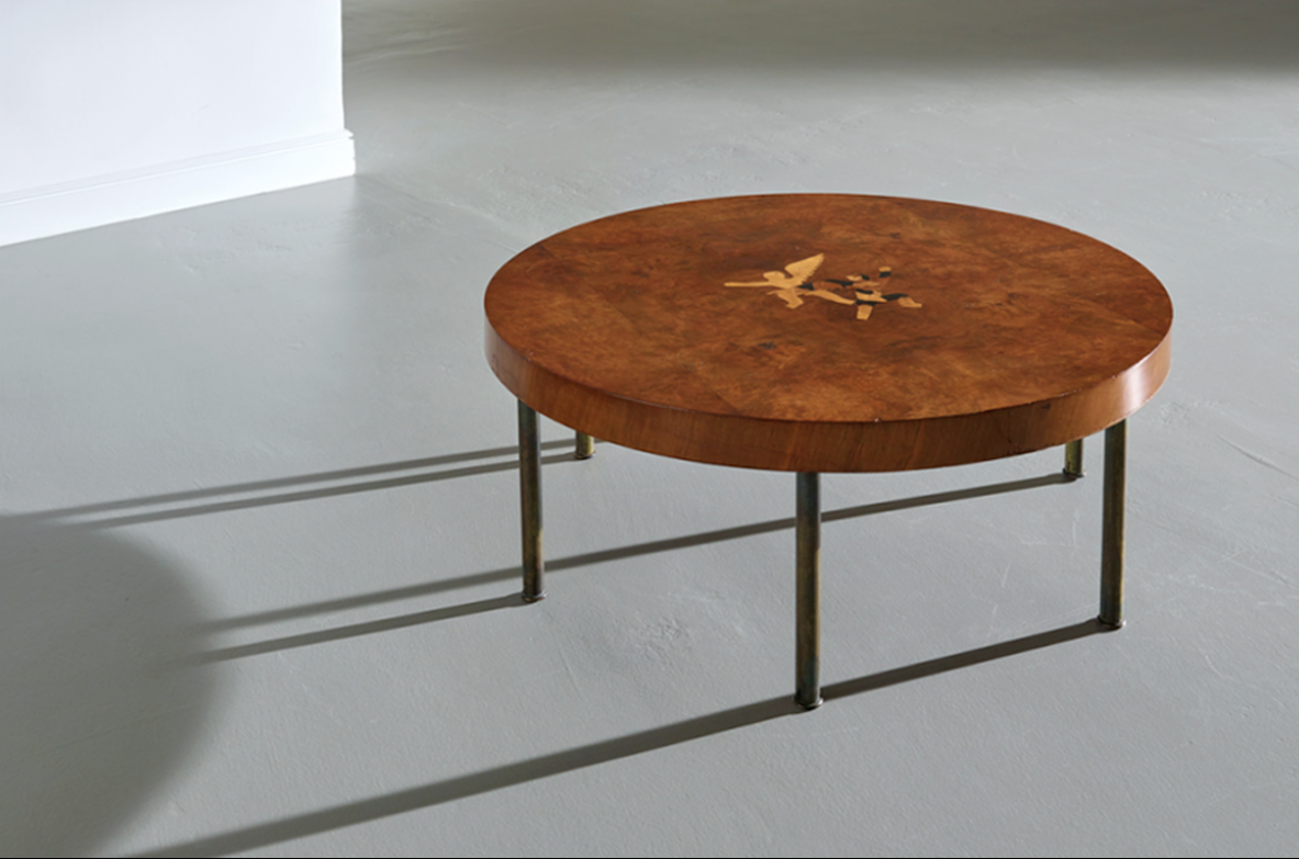 Italian 1930's  coffee table with six brass legs and with allegorical inlay on the top.