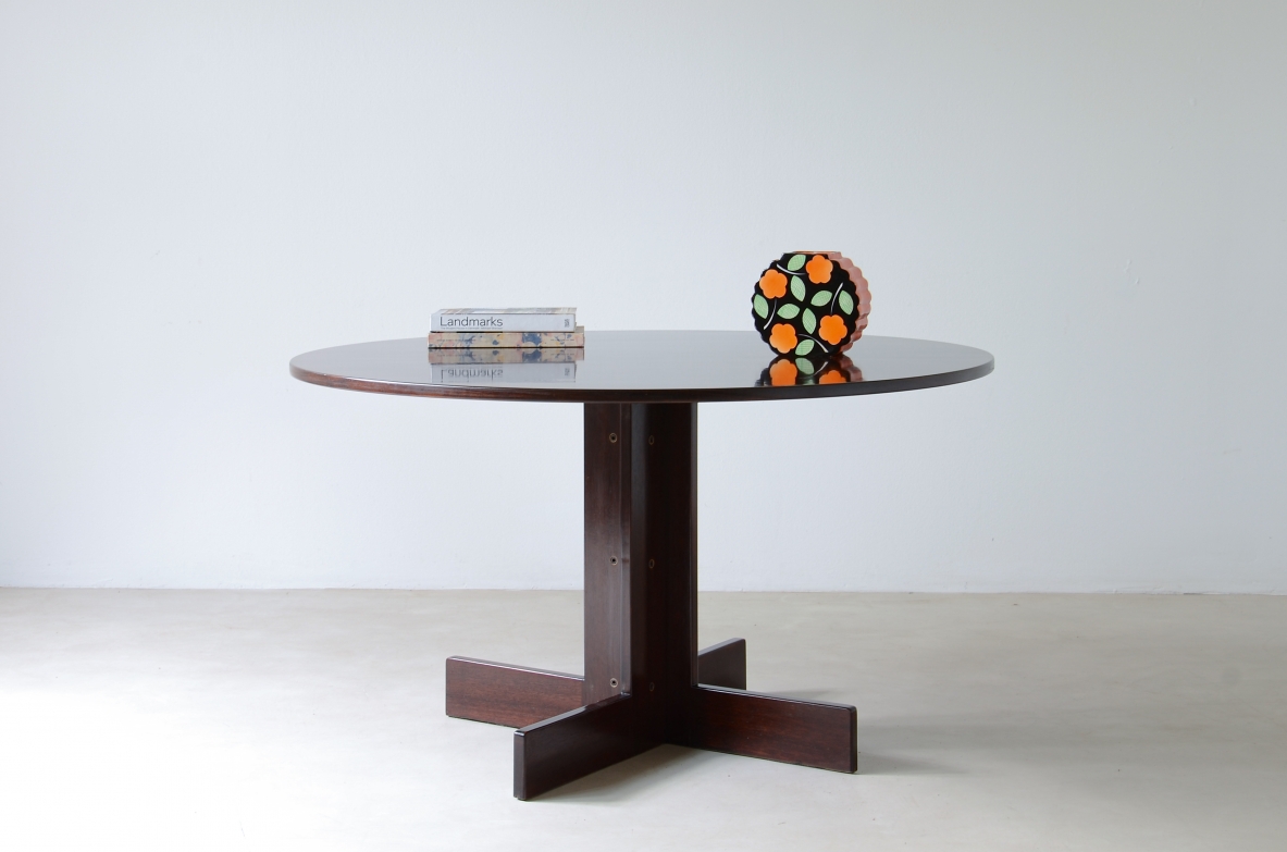Elegant round table in rosewood, metal and glass. Italian manufacture, 1970's.