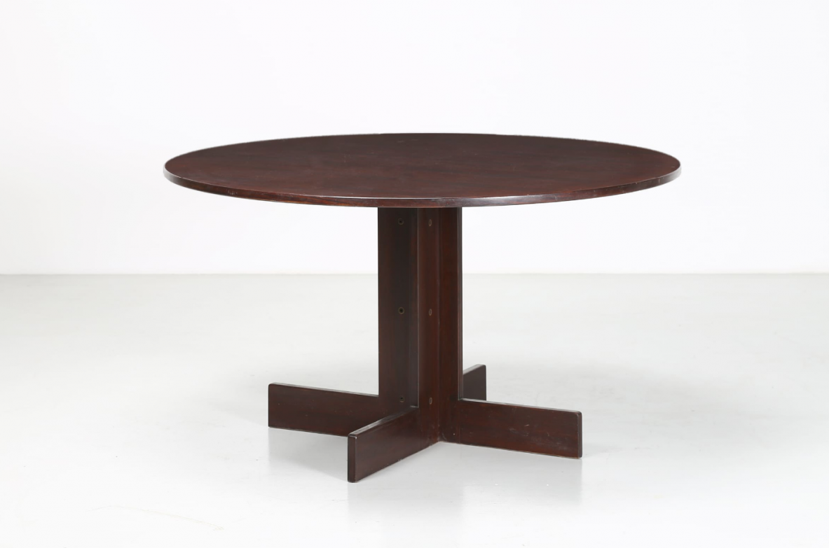 Elegant round table in rosewood, metal and glass. Italian manufacture, 1970's.