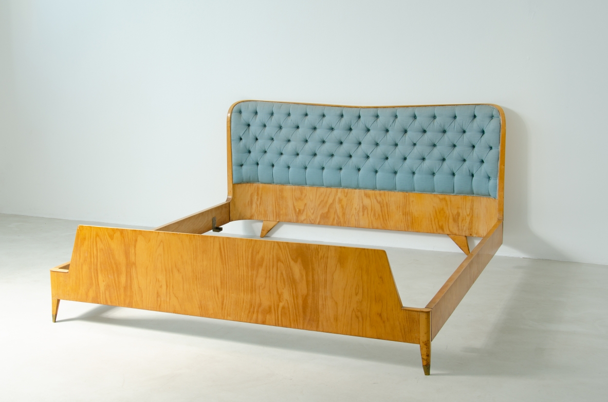 Bed in blond maple with padded fabric headboard and brass tips.  Produced by Cassina in 1957.