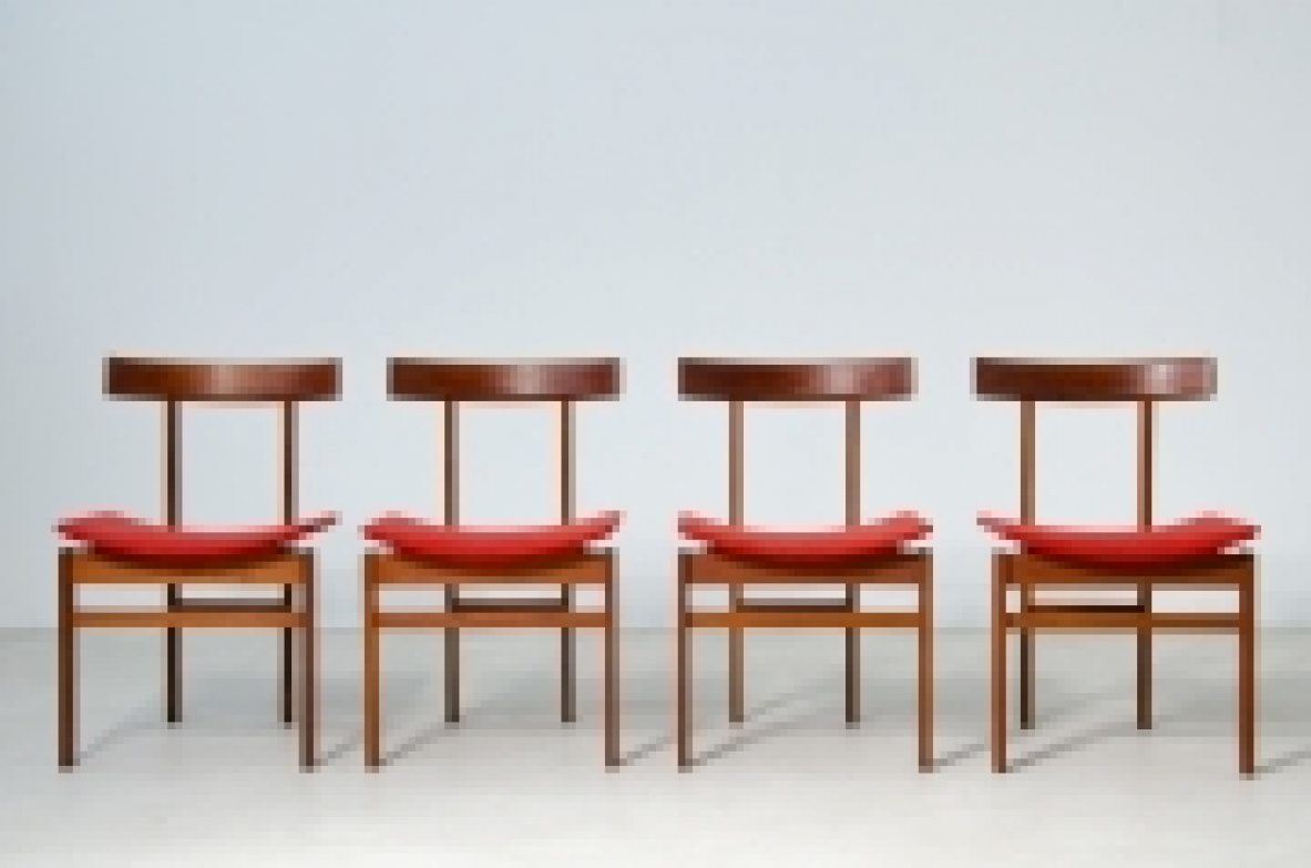 Front view of four Inger Klingenberg Model 193 chairs in a row, with wooden frames, curved horizontal backrests and red upholstered seats.