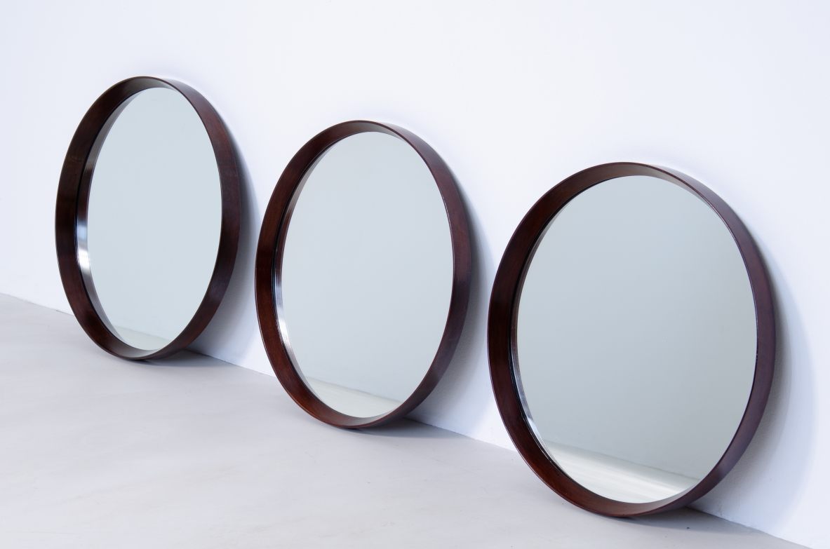 Three round mirrors with wooden frame in hand polished teak wood.  Scandinavian manufacture, 1960s.