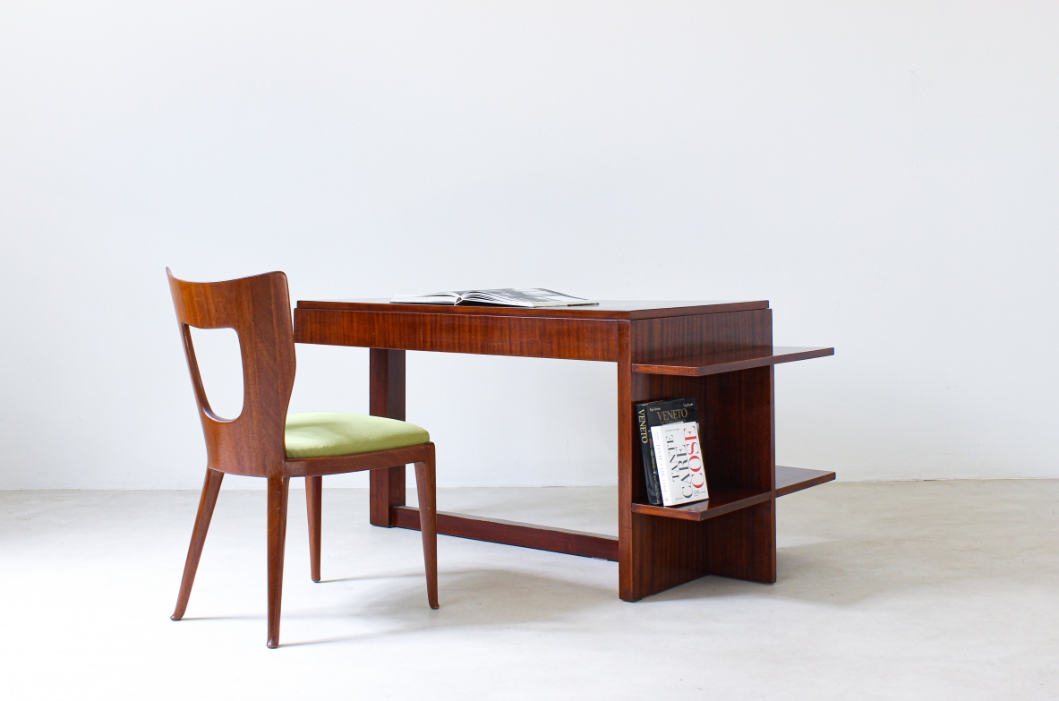 Writing table in walnut with drawers and bookcase shelves on one side.  Italian rationalism, 1930's.