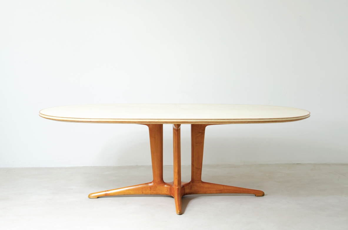 Important large table with elegant structure in blond wood and top covered with goat skin.  Italian 1950s manufacture.
