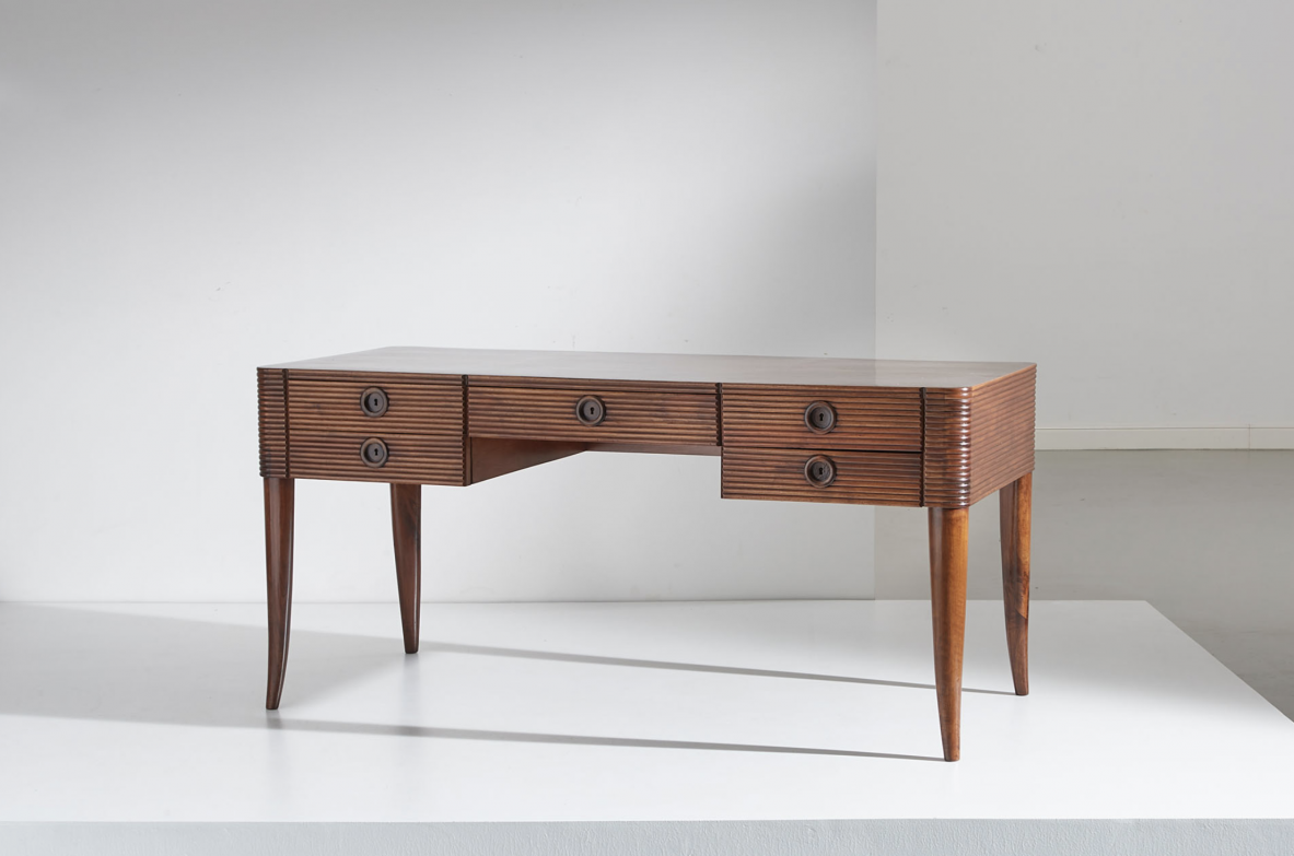 Paolo Buffa (1903-1970)  Elegant wooden desk with five drawers and turned wooden legs.  Manufactured in 1940's.