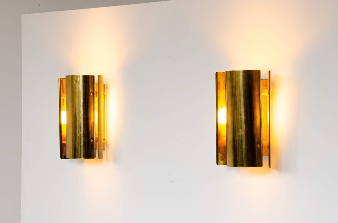 Pair of sconce wall lights in curved brass.  Prod. Falkenbergs, Sweden 1960's.