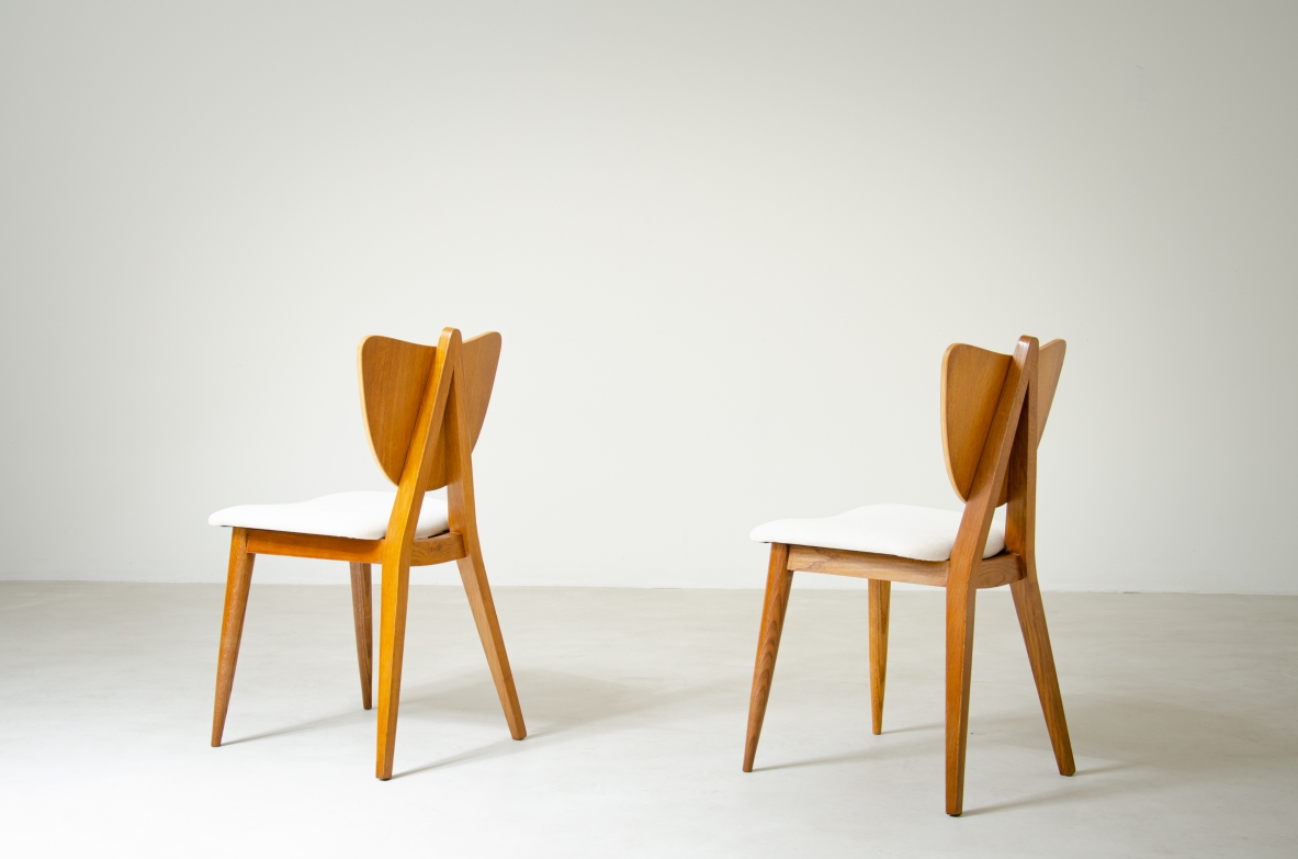 Two oak chairs with padded wooden seat and heart-shaped back.  French manufacture, 1950's.