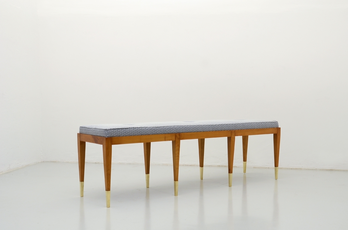 Elegant bench in cherry wood with nice and thin brass tips. Manufactured by Officina Antiquaria