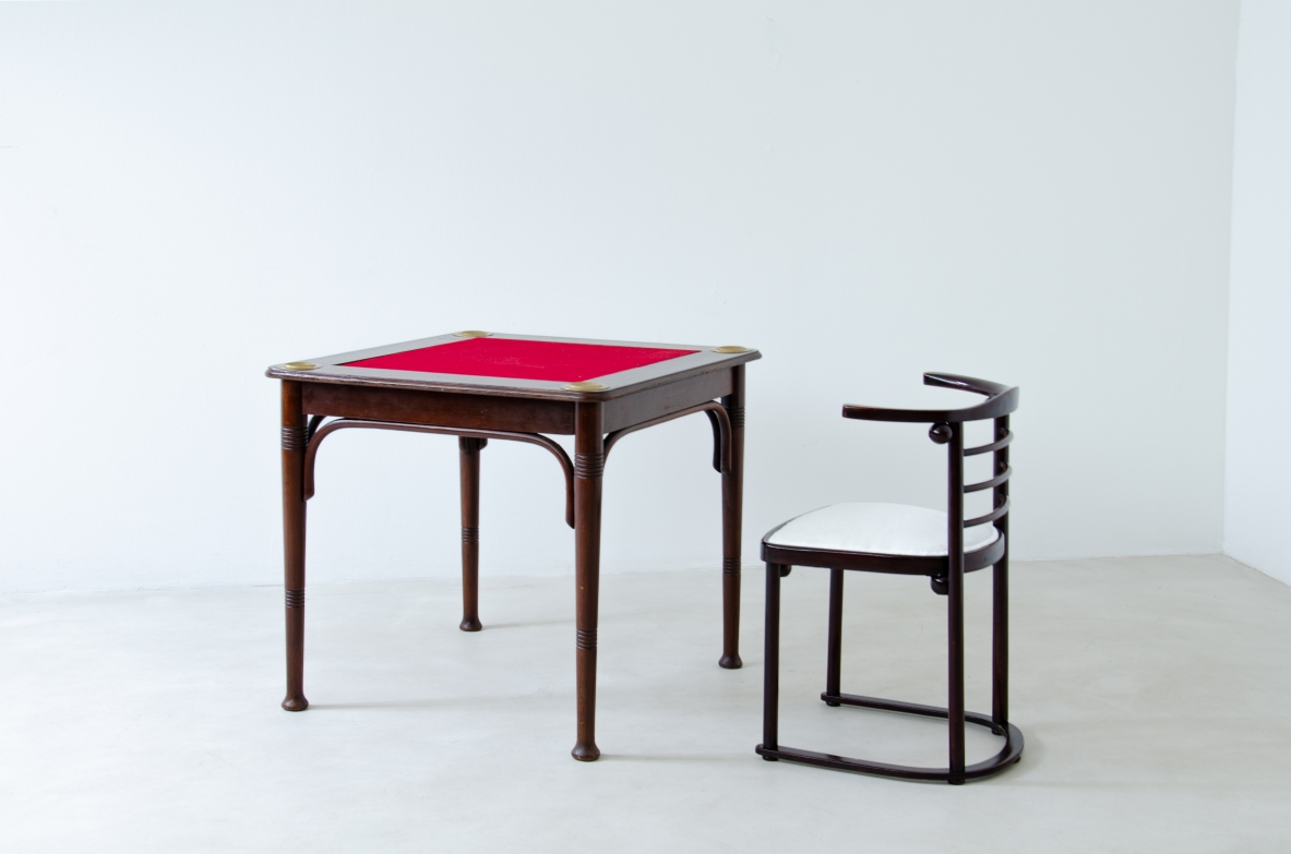 Viennese bentwood table by J.J. Kohn, early 20th century, with square red felt-covered top, brass details and four slender legs.