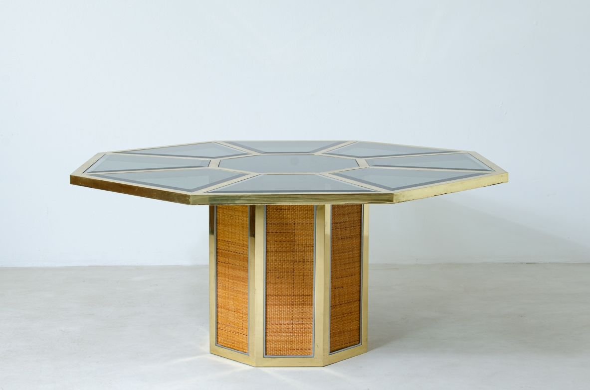 Romeo Rega. Octagonal table in brass, glass and straw. Manufacture Sabot, Italy, 1970's