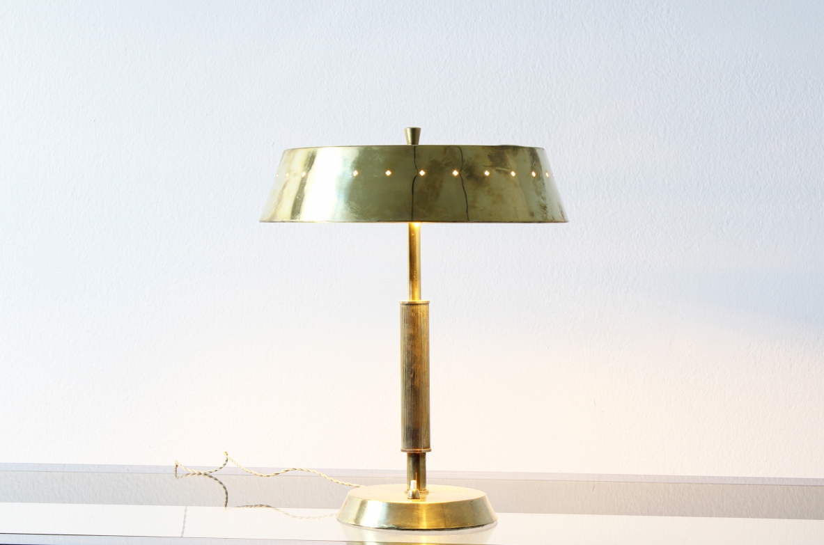 Table lamp in brass with motif of perforated stars on the hat. Italian manufacture, 1940's