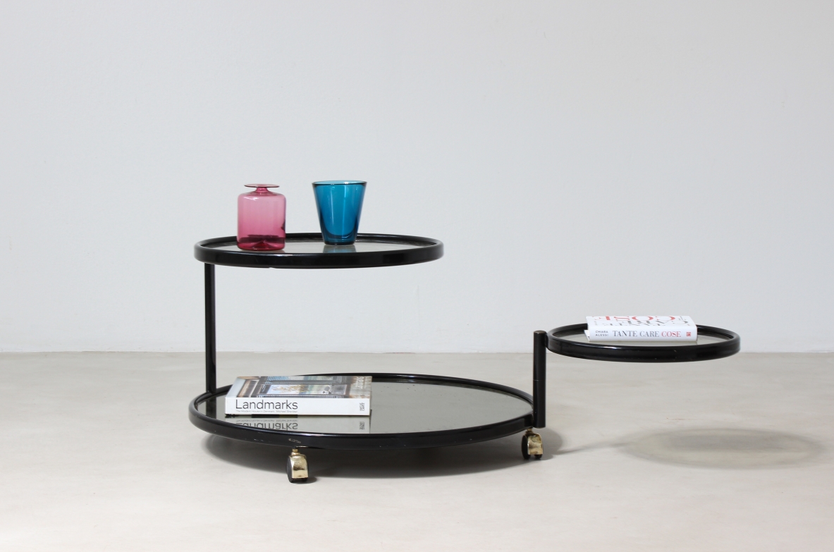 Coffee table in lacquered metal with mirrored top and jointed glass shelves.  Italian manufacture,1970's.