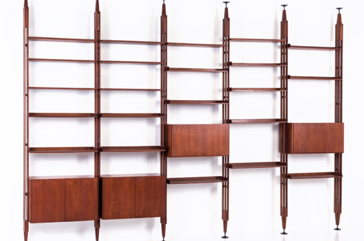 Franco Albini, Infinito bookcase.Large modular bookcase made up of 6 vertical uprights, container elements with hinged doors and lower doors with 22 tek wood shelves.