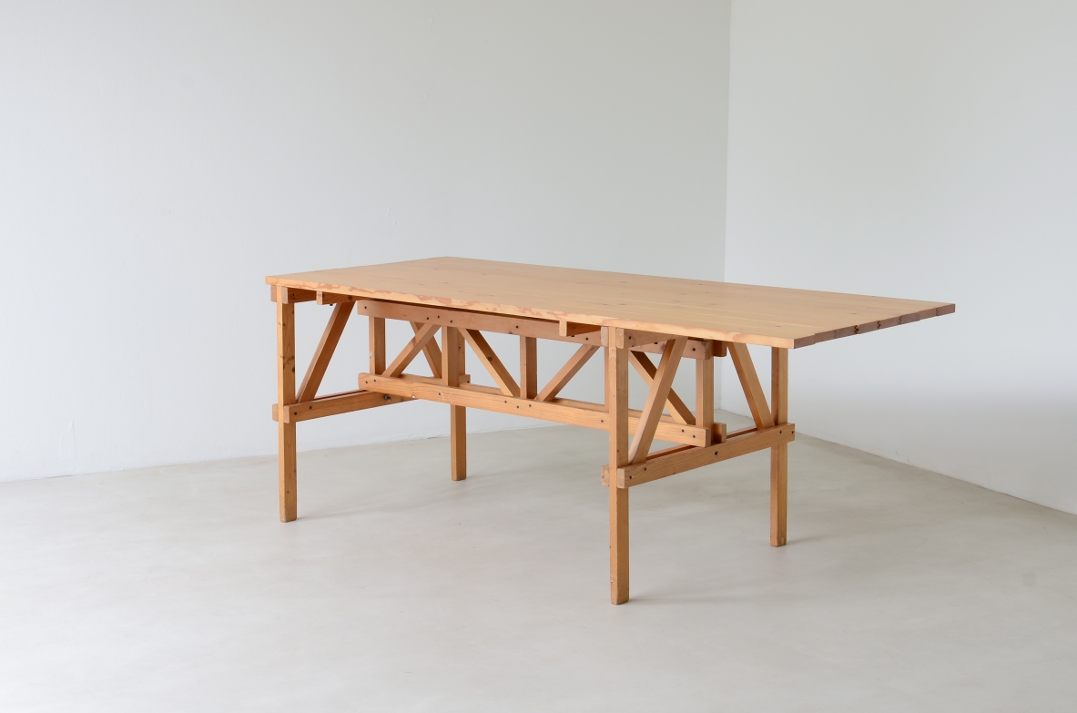 Enzo Mari Effe table for Simon Metamobile, 1974, in unfinished wood with rectangular top and exposed structural frame with diagonal braces, photographed in three-quarter view.