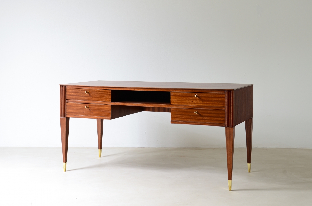 Mahogany desk with 4 drawers, front and sides in grissinato wood, legs with elegant brass tips.  1950s Italian manufacture.