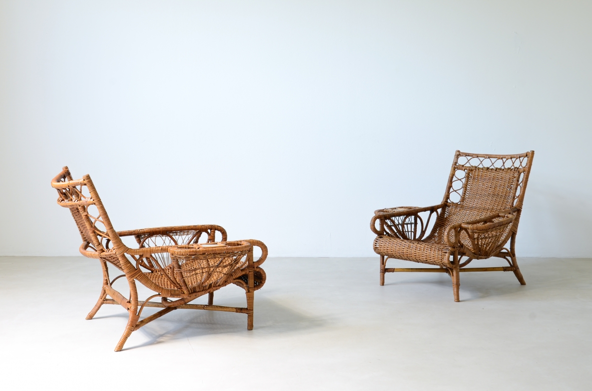 Pair of elegant willow armchairs with weaving on the seat and back as well as composed details, shapes and decorations.  Italian manufacture 1950ca.