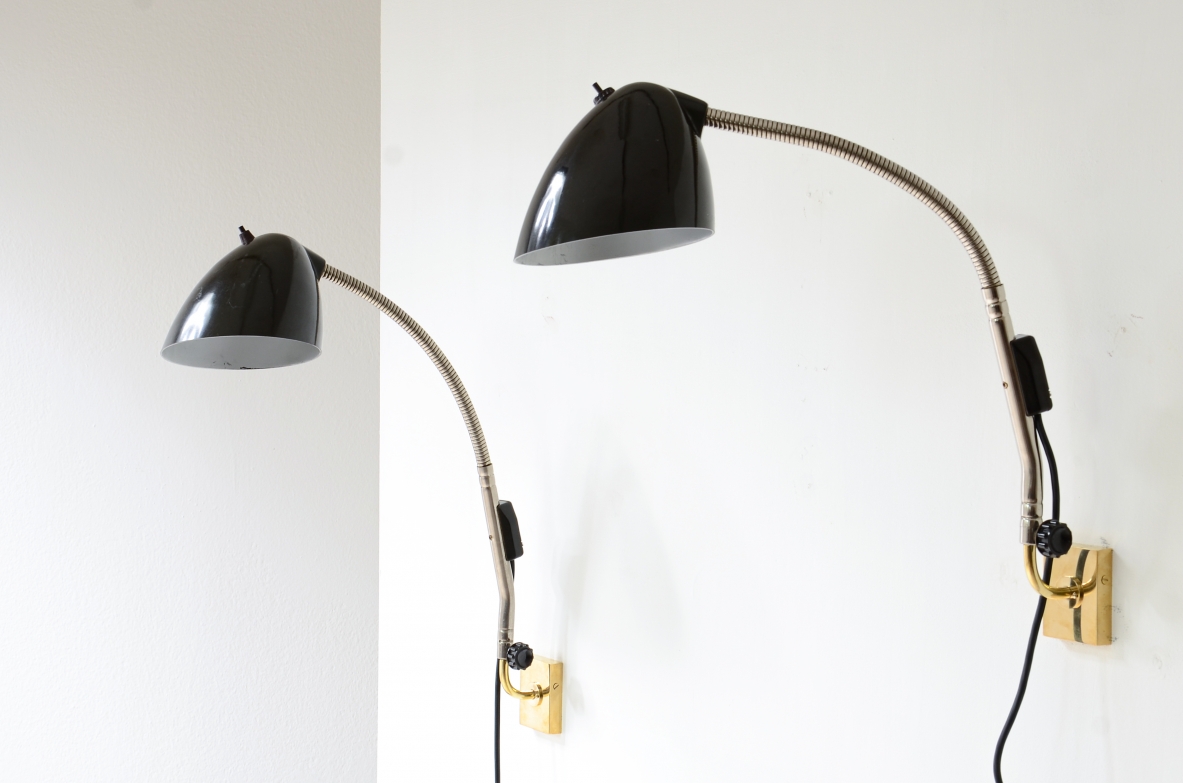 Pair of Bakelite lamps with adjustable metal arm and brass wall plate.  Germany 1930s.