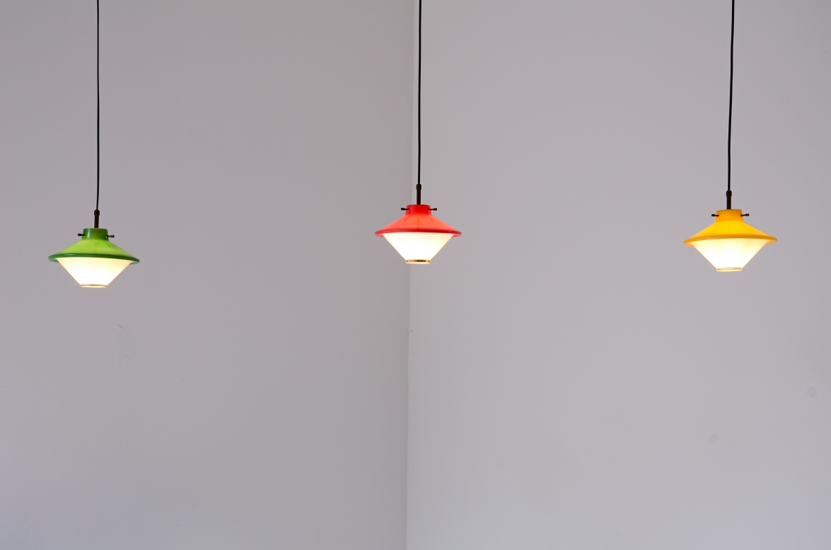 3 small ceiling lamps in printed and colored glass with brass details.  Italian manufacture, 1950.