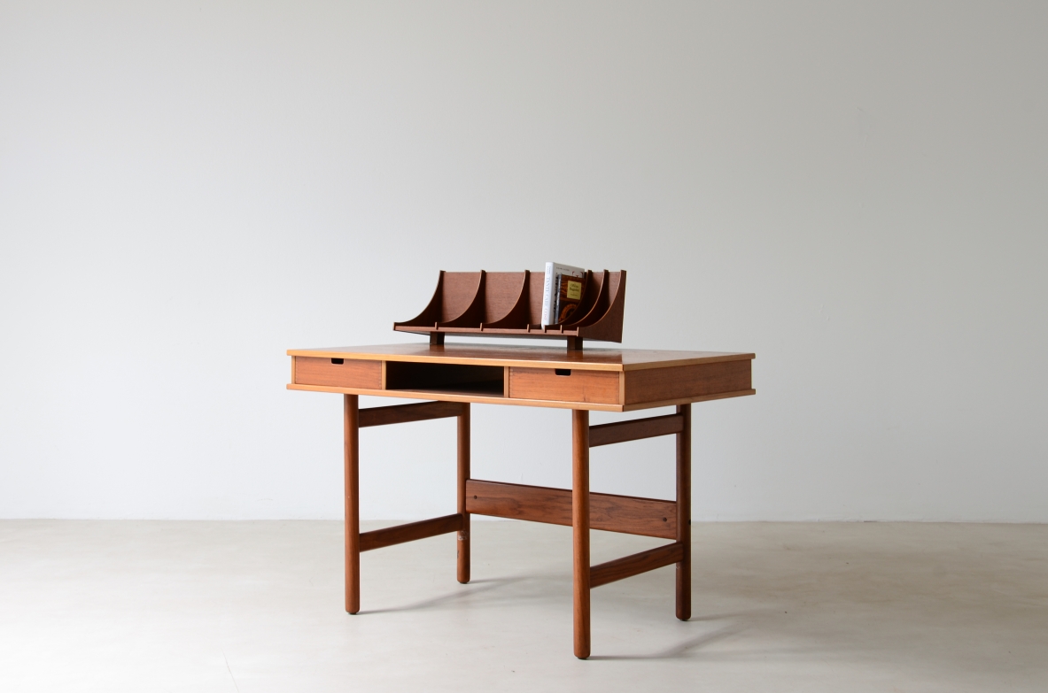 Small Italian freestanding writing desk circa 1960, with two front drawers, open compartment, slender legs and compartmentalized wooden document organizer on top.
