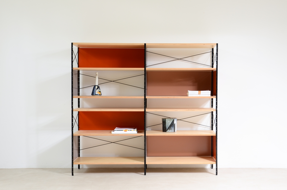Charles and Ray Eames modular shelving unit in birch plywood with colored metal panels