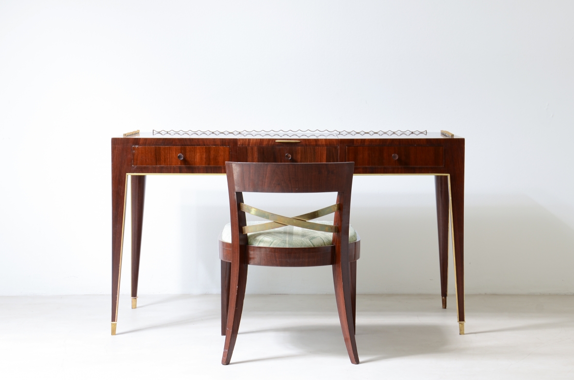 Guglielmo Ulrich  Desk with brass profiles, two small drawers and central compartment. Elegant wave motif on the top and brass tips.