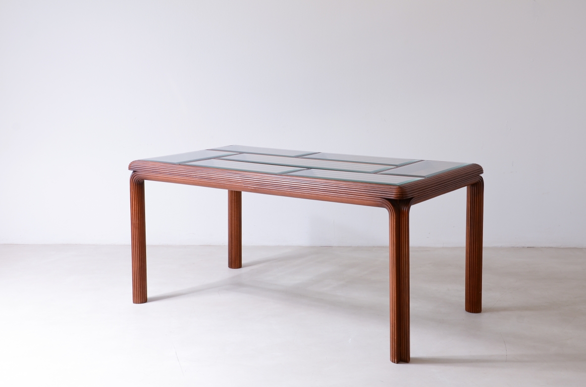 Italian 1970s rectangular table with a curved wooden frame, four cylindrical wooden legs and a geometric faceted glass mosaic top.
