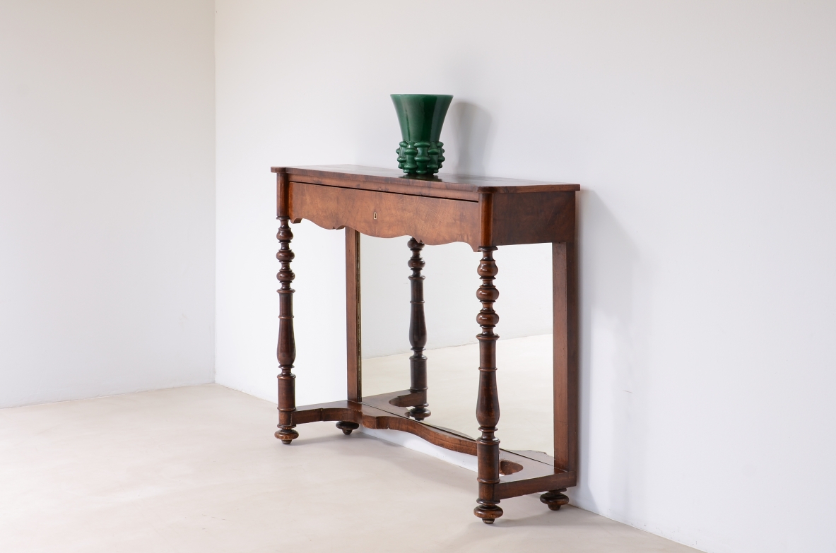 Italian walnut console table with rectangular top, shaped drawer, turned legs and lower stretchers.