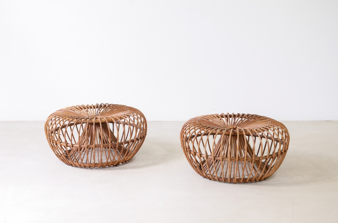 Pair of 1960s Bonacina seats in natural bent and woven rattan, featuring rounded circular forms and openwork woven construction.