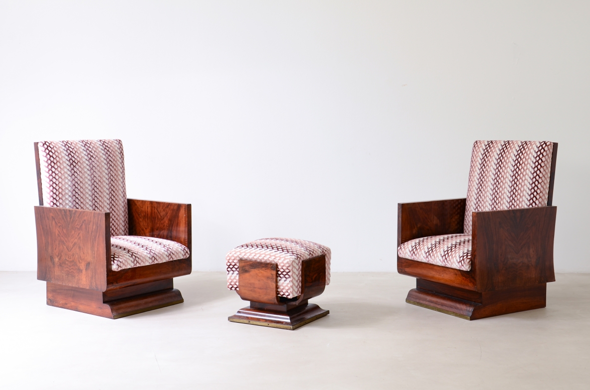 Pair of Gaetano Borsani Art Deco armchairs with geometric wood and burl veneer frames, tall upholstered backs in pink striped fabric and plinth bases, with a small matching stool between them.