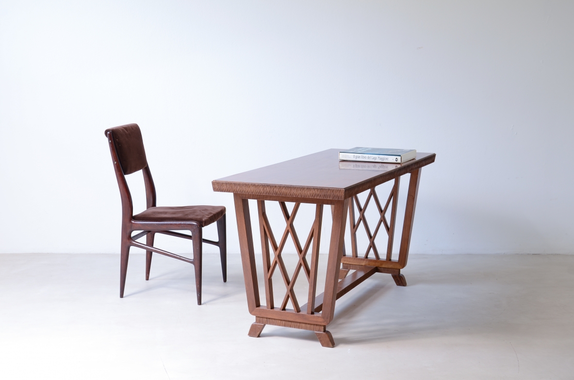 Pierluigi Colli walnut writing desk, Turin, circa 1940, with rectangular top, sculptural interlaced side supports and textured wood details.