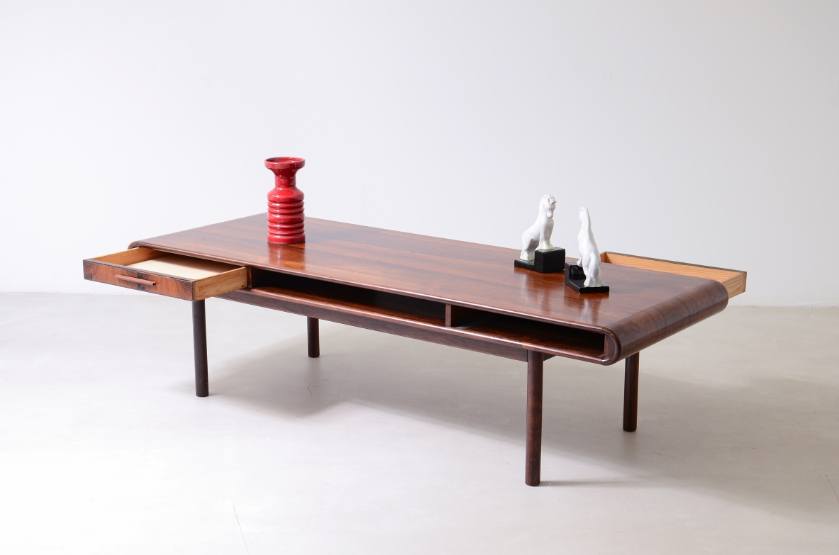 low table with two tops, an open compartment, and two drawers.Brazilian manufacture, ca. 1960.